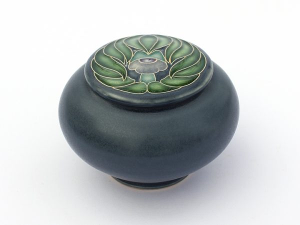 Peacock flower covered jar